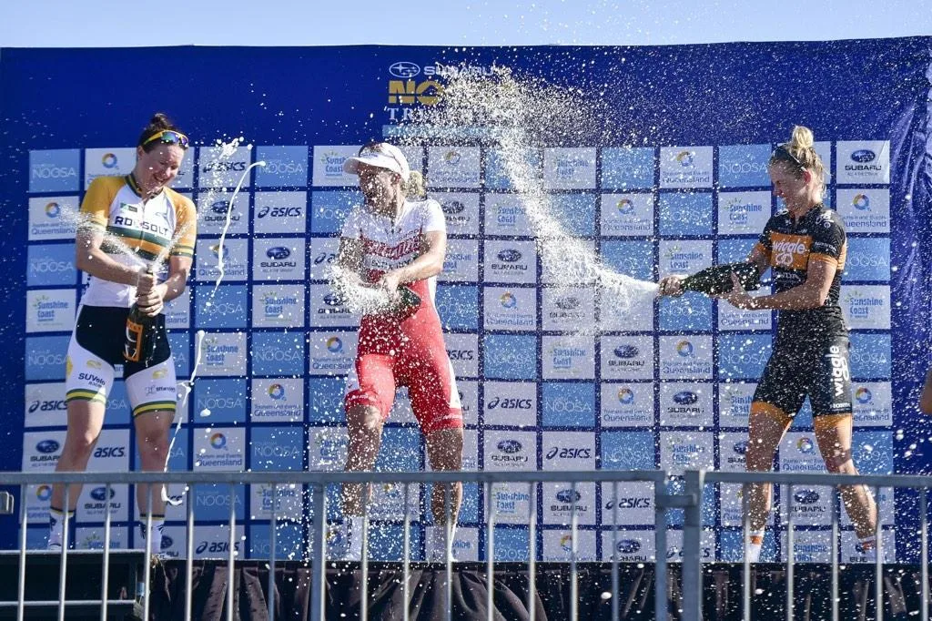 Dr Kimberley Wells celebrating a win at the Noosa Festival of Cycling